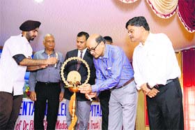 President of the Dental Council of India Dr Dibyendu Mazumder lights the lamp during a function at Himachal Dental College in Sundernagar on Wednesday
