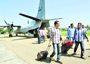 Evacuees arrive in an IAF aircraft after being rescued from Srinagar on Thursday.