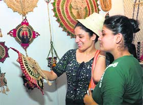 Visitors admire jute items at the exhibition 