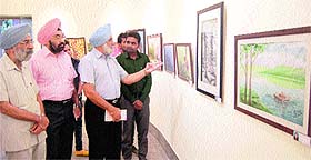 An art exhibition at the art gallery generates a good response with different artists bringing their works under one roof in Amritsar on Friday. photo: vishal kumar