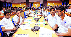 Students participate in a debate competition at Panjab University on Friday
