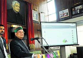 BBL Butail, Speaker, inaugurates the website e- Vidhan at the Vidhan Sabha in Shimla on Friday.