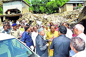 Chief Minister Virbhadra Singh visits the flood-hit area at Dharampur in Mandi on Friday. 