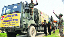 Trucks carry relief material to be airlifted to the flood-hit Jammu and Kashmir from the Jalandhar Cantonment. Tribune photo: Malkiat Singh