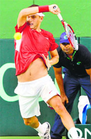 Filip Krajinovic of Serbia plays a shot against Somdev Devvarman during the Davis Cup tie in Bangalore on Friday. Devvarman lost 6-1, 4-6, 6-3, 6-2. 