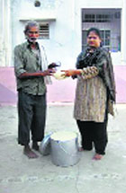 Manju Latha Kalanidhi (R), a Hyderabad-based journalist, started the rice bucket challenge