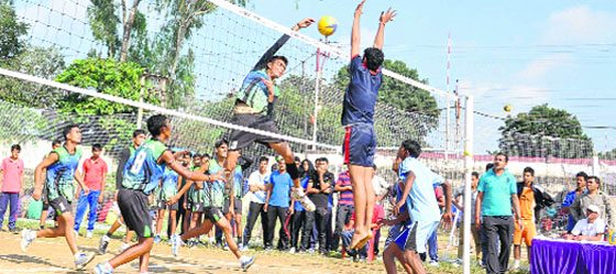 A match in progress in the state-level volleyball tournament in Dehradun on Friday. Tribune photo: Abhudaya Kotnala