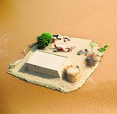An aerial view of flood-affected residents in the compound of their home on the outskirts of Multan on Friday