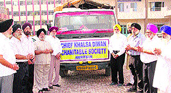 Office-bearers of the Chief Khalsa Diwan after dispatching blankets for the flood-hit in Jammu and Kashmir in Amritsar on Saturday