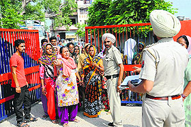 Kin of the deceased girl protest out side the Canal Colony police station demanding registration of an FIR against the accused in Bathinda on Saturday.