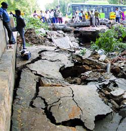 A portion of K.G. Marg caved in near the Northern Railway headquarters in New Delhi on Saturday.