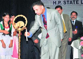 Justice Mansoor Ahmad Mir, Chief Justice, HP, lights a lamp to inaugurate a state conference on mediation at Palampur on Saturday