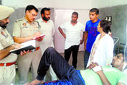 Police officials record the statement of one of the victims at a hospital in Jagraon on Saturday