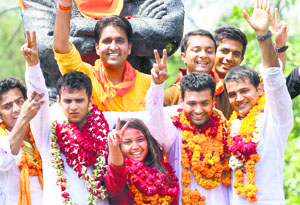 Winners of the DUSU elections pose for a photograph in New Delhi on Saturday.