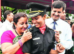 A cadet with her parents after a passing out parade at the OTA in Chennai.