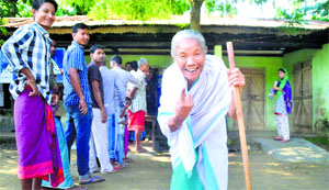 An elderly woman comes out of a polling station in Nagaon district of Assam on Saturday.