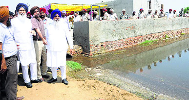Chief Minister Parkash Singh Badal at a waterlogged village in Muktsar on Saturday. 