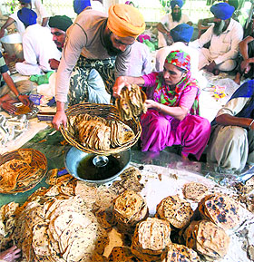 Langar being prepared for those hit by floods in J&K at the Golden Temple in Amritsar on Saturday.