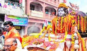 Activists of the Shri Devothan Sewa Samiti hold a procession in Haridwar on Saturday