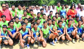 The winning team of Maharana Pratap Sports College with the trophy in Dehradun on Saturday
