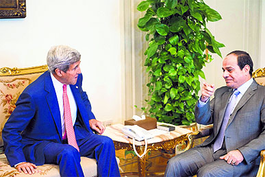 US Secretary of State John Kerry (L) and Egyptian President Abdel Fattah al-Sisi talk before a meeting at the presidential palace in Cairo on Saturday.