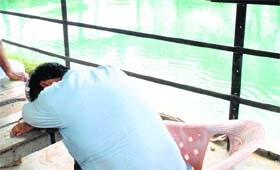 A relative awaits identification of the body at Bhakra Canal.