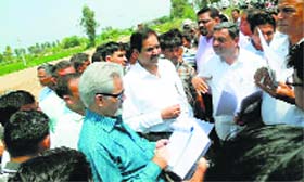 A central team of officers from Union Ministries interacts with drought-hit farmers in Kaithal on Sunday.
