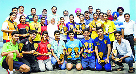 Winners of the Punjab State Inter-District Badminton Tournament with their trophies 