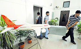 Workers remove belongings of former Civil Aviation Minister Ajit Singh from his government accommodation at Tughlaq Road in New Delhi on Sunday. 