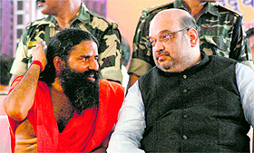 Yoga guru Ramdev in conversation with BJP national president Amit Shah during the inauguration of Sewa Sadan at Patanjali Yogpeeth in Haridwar on Sunday.