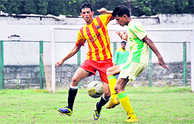 Players in action during a match in the Nemidas Memorial District Football League at Pavilion Ground in Dehradun on Sunday. 