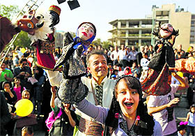 Puppeteers show off their puppets on Sunday, the first day of the 15th Tehran International Puppet Festival. 