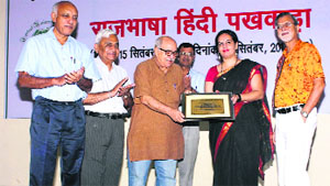 Prof Ram Sharan Joshi being felicitated during the Hindi Pakhwara programme at Central University of Punjab in Bathinda on Monday.