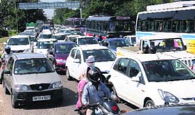 Rush hour: Traffic snarls in mornings and evenings on working days are common around Tribune Chowk