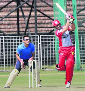 Virender Sehwag plays a shot while practising at the cricket stadium in Sector 16 in Chandigarh on Monday