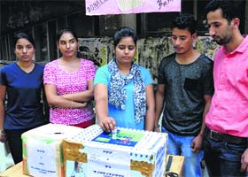 A student donates money to help the J&K flood-hit on the Panjab University campus in Chandigarh