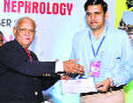Dr Dass gives away a prize to Dr Yadav at the national conference of the Indian Academy of Nephrology held in Indore. tribune photo