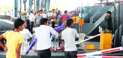 Villagers damage the Kherki Daula toll plaza in Gurgaon on Monday. Tribiune photo Sayeed Ahmed