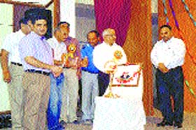 Principal Dinesh Sharma, VK Awasthi and others light the lamp on Engineers Day at Government Polytechnic College in Kangra on Monday