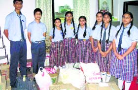 Students of HVM Convent School with the relief material in Ludhiana.