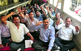 Striking ministerial collectorate employees hold a dharna in Dehradun on Monday. 
