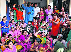 BJP workers protest delay in the installation of the sewage treatment plant at the office of the Peyjal Nigam in Dehradun on Monday.