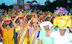 Devotees take part in a religious procession before the commencement of the Shrimad Bhagwad katha at Raj Vihar in Haridwar.