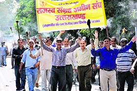 Members of the Uttarakhand Rajsva Sangrah Ameen Sangh protest in support of their demands in Dehradun on Monday.