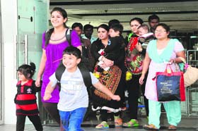 Safe return: Survivors of the Jammu & Kashmir floods come out of the Sri Guru Ramdas Jee International Airport in Amritsar on Tuesday