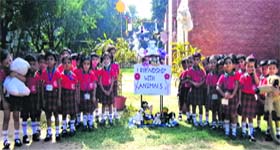 Getting close to nature: Students of the nursery class during a special assembly on the theme “Friendship With Animals” at Tribune Model School, Sector 29, Chandigarh, on Tuesday. During the programme, children were taught yogasanas based on attributes of various animals.