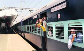 Passengers on board the Chandigarh-Jaipur Express at the city railway station on Tuesday.