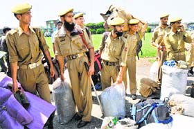 Call of duty: Police personnel wait at the technical airport in Jammu to be airlifted to Srinagar