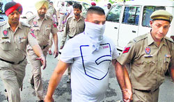 Yannick case accused Jaskaran being produced in court in Jalandhar on Tuesday. Tribune photo: Sarabjit Singh