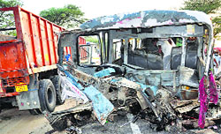 The mangled remains of the bus that collided with a trailer in Hanumangarh. tribune Photo